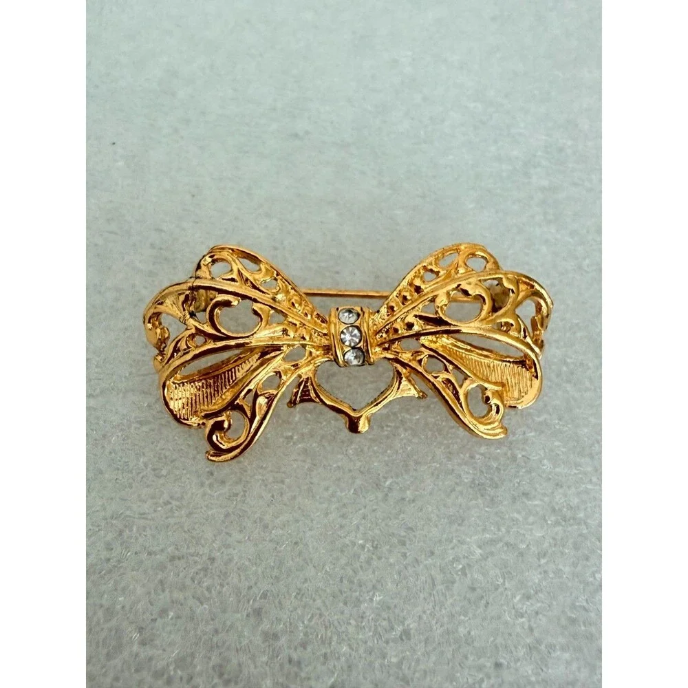 Vintage Gold Tone Openwork Filigree Bow Brooch Rhinestone Accent Pin